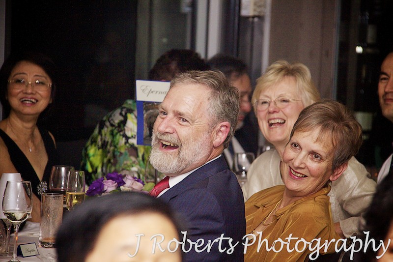 guests laughing at wedding speeches - wedding photography sydney